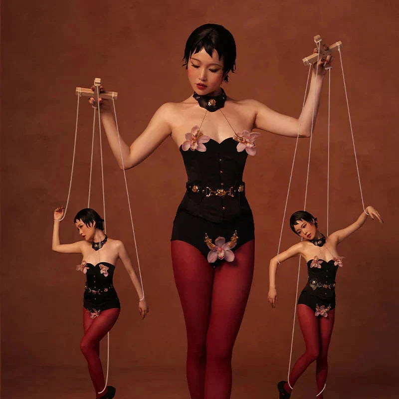 model display of creative restraint belts use as puppets and puppet master