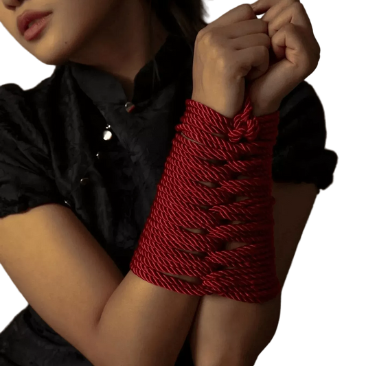 model product demp wearing woven wrist束缚 red shibari rope